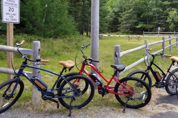 a bicycle parked in front of a sign